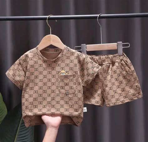 newborn gucci dress|Gucci baby jumpsuit.